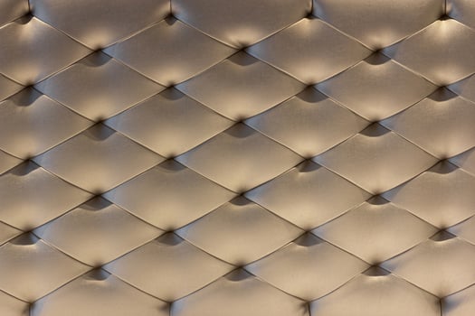 Pattern of Gold Leather Upholstery Sofa Background. Luxury Decoration Sofa photo