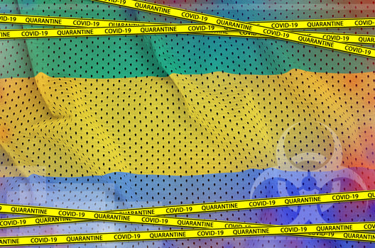 Gabon flag and Covid-19 quarantine yellow tape. Coronavirus or 2019-nCov virus concept photo