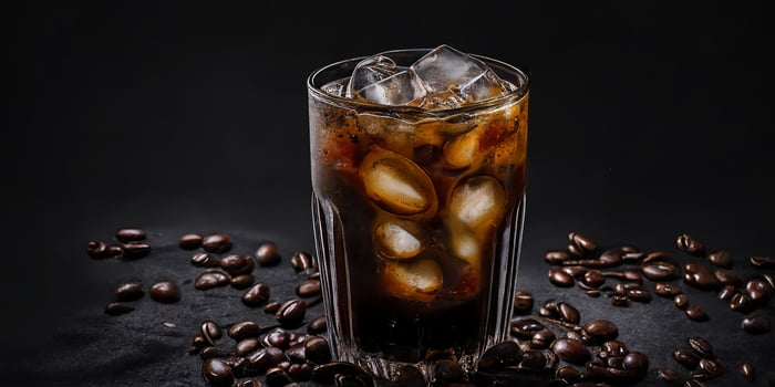 The glass of Ice Americano coffee in the black background with . photo