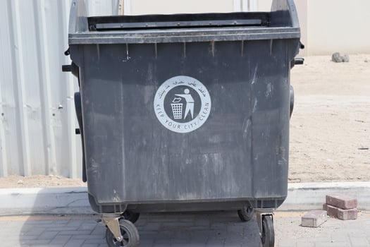 Gray recycle plastic bin outdoor with white symbol,trash bin photo