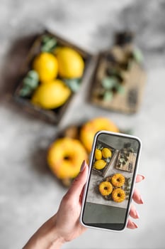Delicious fresh donuts in yellow glaze with lemon flavor filling photo