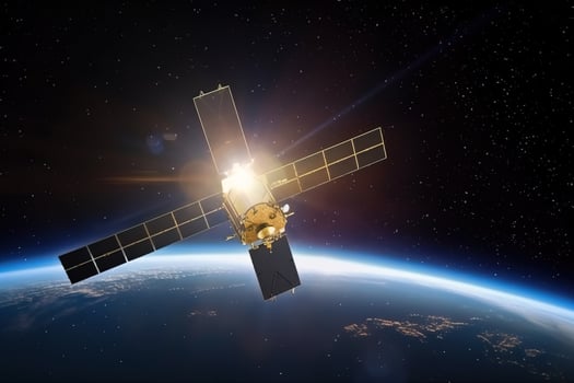 A satellite is flying in orbit around the planet Earth. Against the background of the planet and blue space in the rays of the sun. . photo