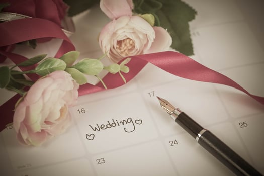 Reminder Wedding day in calendar planning and fountain pen with color tone. photo