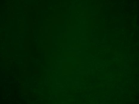 Dark green old velvet fabric texture used as background. Empty green fabric background of soft and smooth textile material. There is space for text.. photo