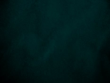 Dark green old velvet fabric texture used as background. Empty green fabric background of soft and smooth textile material. There is space for text.. photo