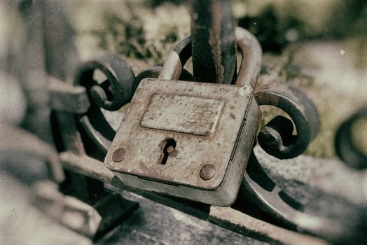 vintage padlocks pinned to the fence as a symbol of love with the names of the lovers inscribed photo