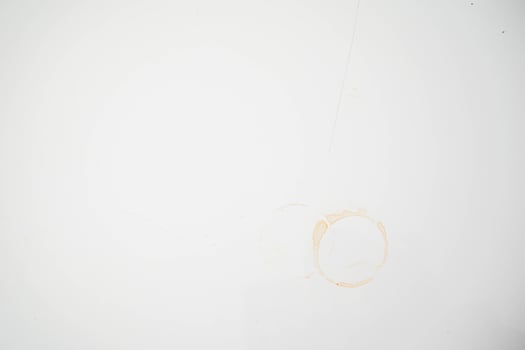 plain white background with brown stains of black coffee mug photo