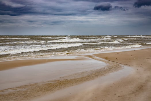 landscape from the beach on the Polish Baltic Sea on a cloudy cool windy spring day photo