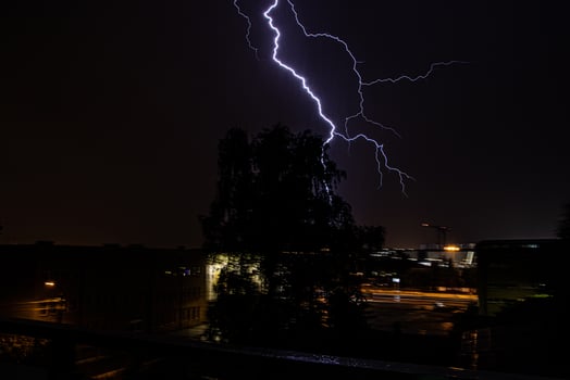 beautiful night summer suburban landscape with storm and lightning photo