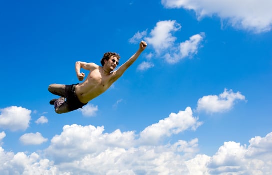 The crazy flying man in clouds photo