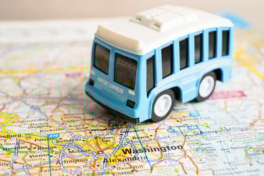 Bangkok, Thailand September 1, 2022 Bus car vehicle to travel on world map, geography, tourism and exploration concept. photo