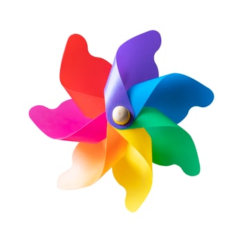 Colorful toy windmill on white background photo