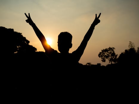 Back of man with sun background. freedom feeling. new beginning photo