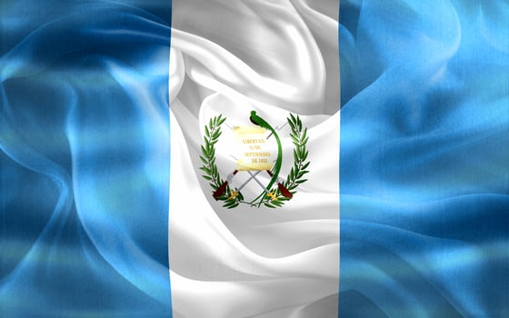 Guatemala flag - realistic waving fabric flag photo