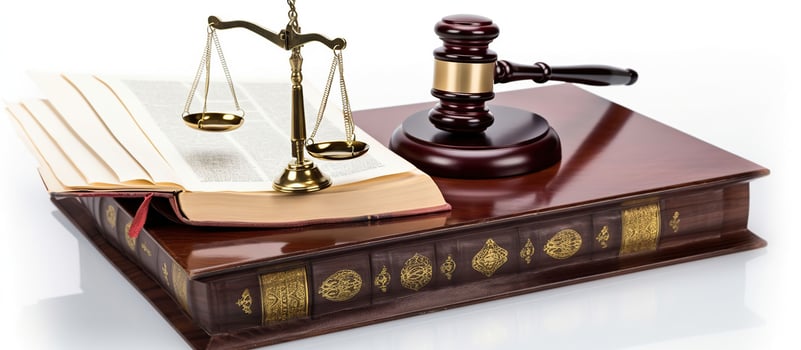 Law concept - Open law book with a wooden judges gavel on table in a courtroom or law enforcement office isolated on white background, photo