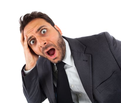 a man in a suit and tie is making a surprised face photo