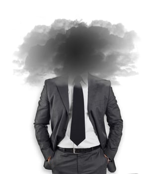 businessman with head in the clouds photo