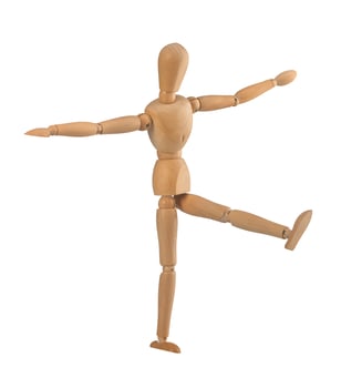 Wooden dummy in the balance photo