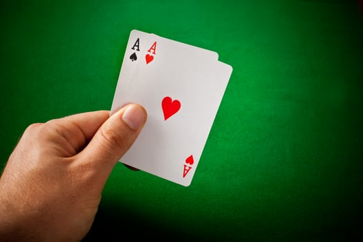 A hand holding a card with a heart on it photo