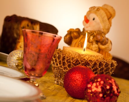 Table with candle for Christmas dinner photo