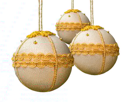 Homemade christmas balls coated with golden fabric. photo