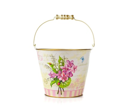 Empty bucket with vintage floral decorations photo