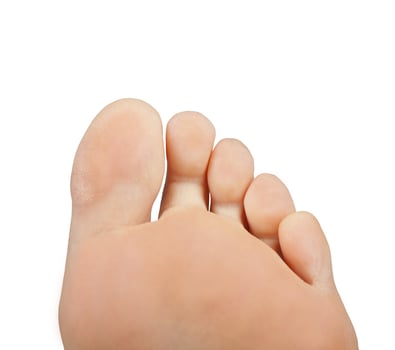 A person's foot with a white background photo