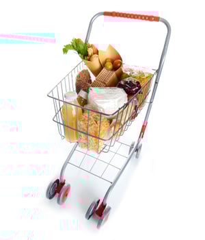Shopping cart full with food products photo