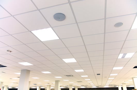 White office ceiling with white tiles and lighting photo