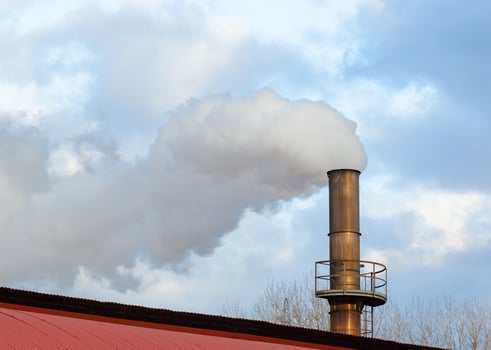 Chimney of a factory, Industrial process that produces white smoke. photo