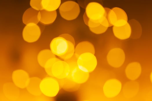 Blurred background of colored yellow lights. photo