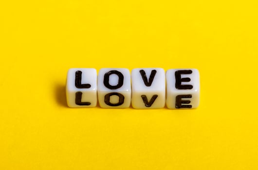 Love text on yellow background. photo