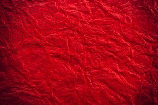 A red crumpled paper texture background photo
