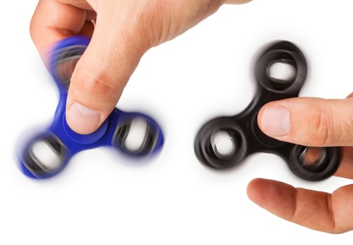Playing with two Fidget Spinner photo