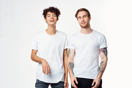 two men are standing next to clean t-shirts emotions communication studio photo