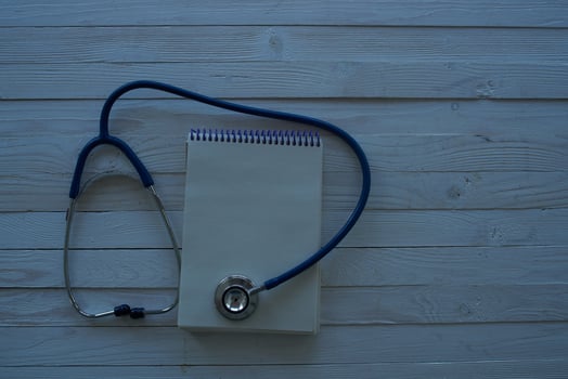 pills stethoscope wooden background treatment hospital photo