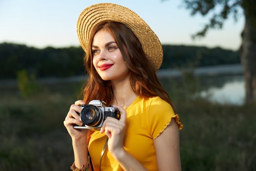 Pretty woman smile red lips camera nature fresh air yellow t-shirt hat photo