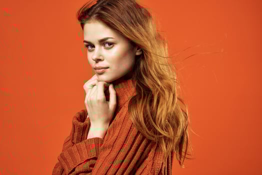 woman in red sweater glamor fashion posing isolated background photo