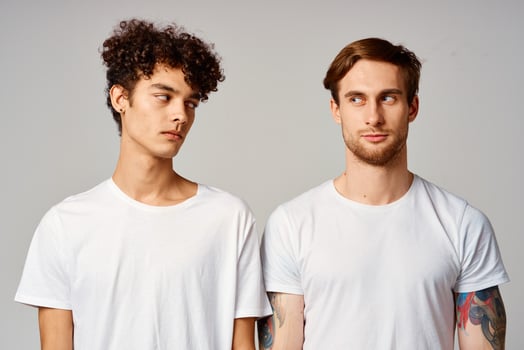 two friends in white t-shirts fun emotions isolated background photo