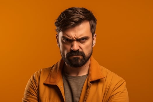 a man on solid color background photoshoot with Anger face experession photo