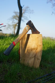 Axe. Big axe in a wood log. Chopping the wood. photo