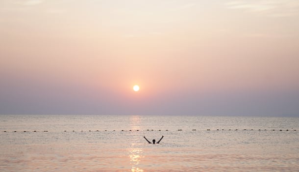 Life is good. Successful man enjoying life and freedom. Swimming enjoying nature. photo