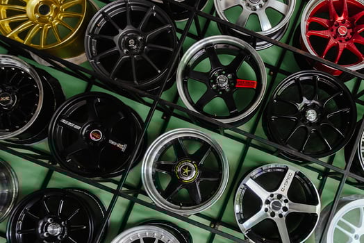 Alloy wheels on showroom rack in tire warehouse photo