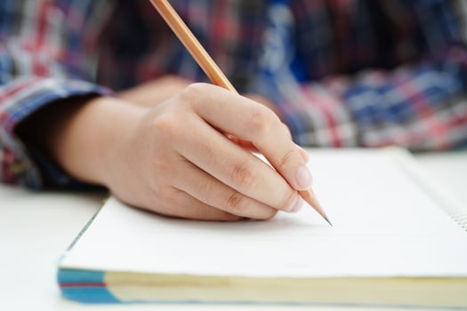 Asian teenage student write homework, study lesson for exam online learning education. photo
