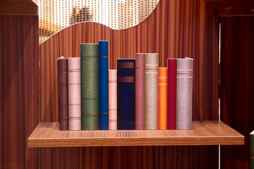 stack of books on wooden table photo