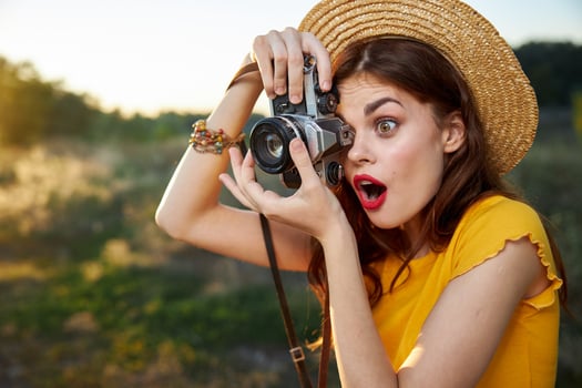 surprised woman taking nature snapshot lifestyle hobby photo