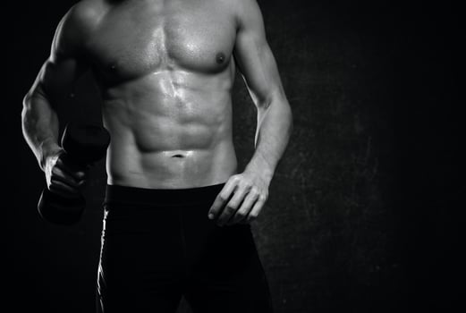 man with a pumped-up torso muscles dumbbells exercise gym photo