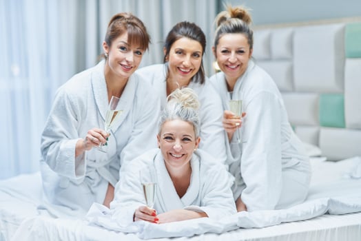 Girls with wine at spa party in the hotel photo