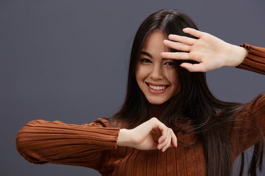 pretty woman fun brown sweater posing casual wear Lifestyle photo