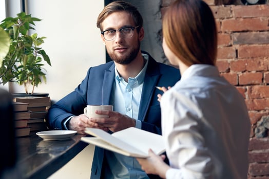 business man and woman work colleagues cafe breakfast communication photo